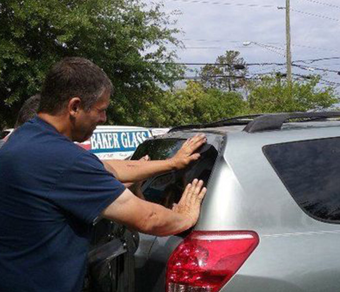 BG employee replacing windshieeld